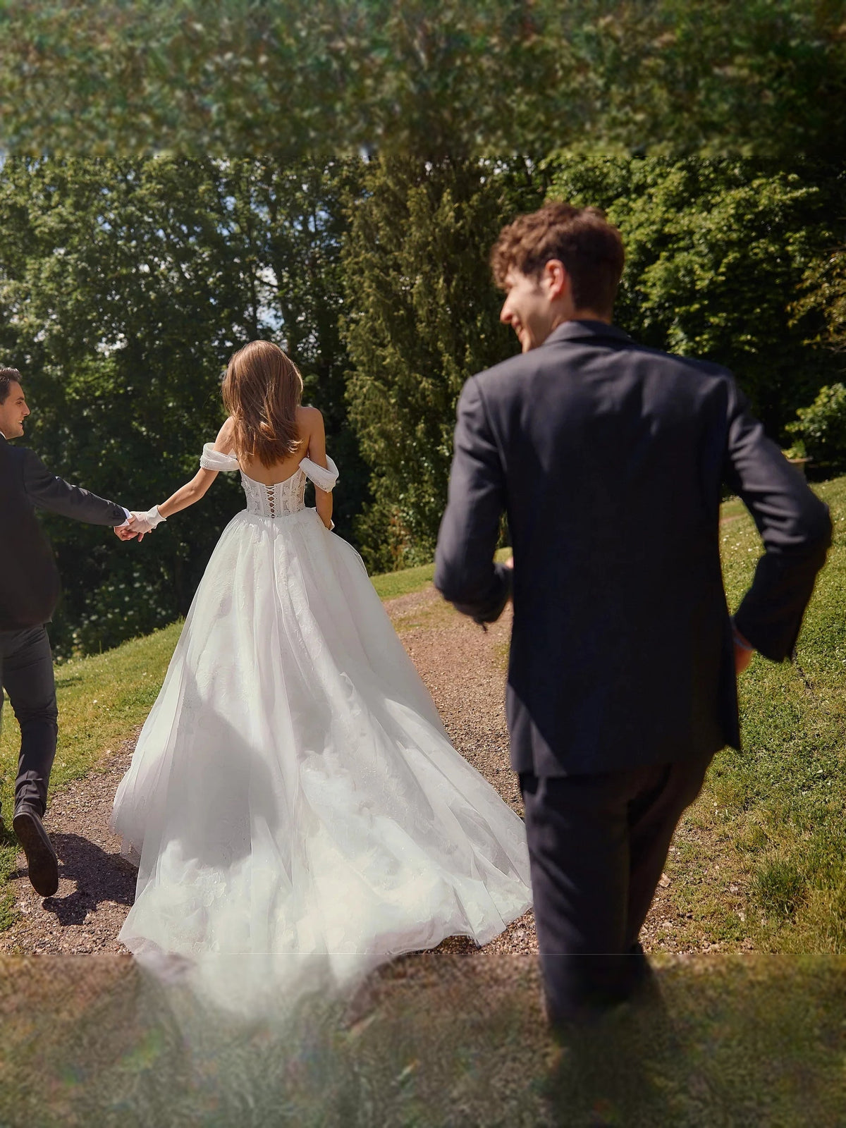 Ivory A-line wedding dress with back view tulle skirt and long flowing train