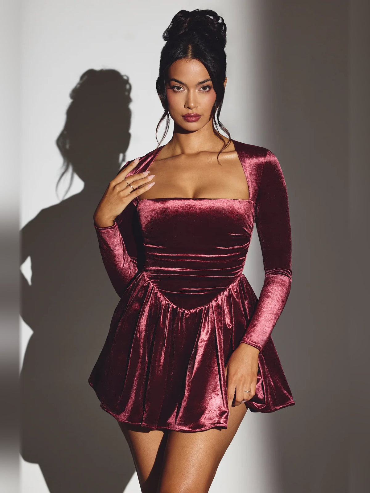 Wine velvet corset mini dress with long sleeves, square neckline, ruched waist and flare.