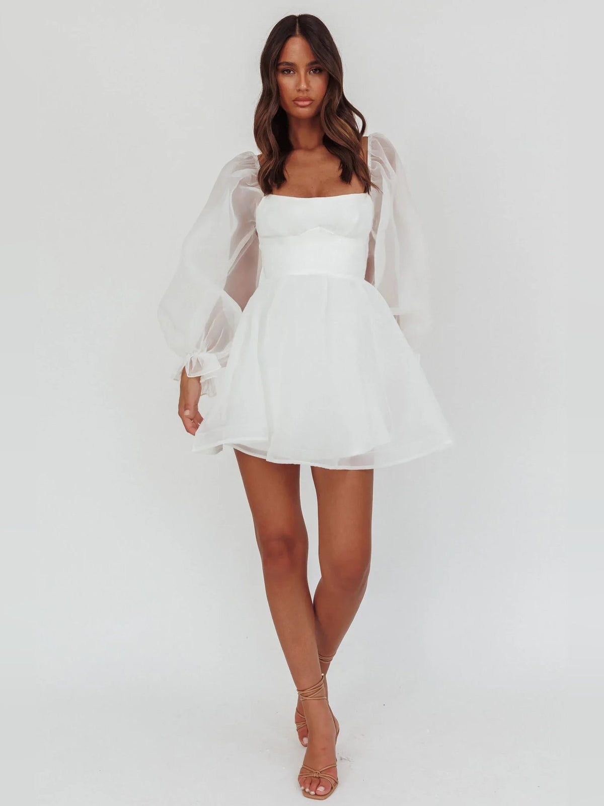 White mini A-line satin dress with square neckline and sheer puff sleeves