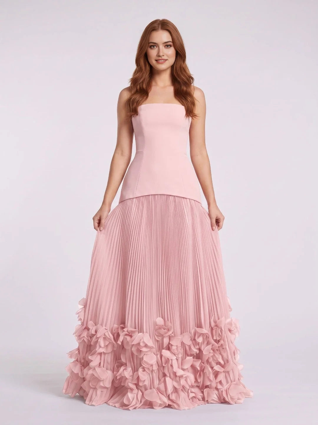 Blush pink strapless wedding dress with pleated skirt and rose-like layered ruffle hem
