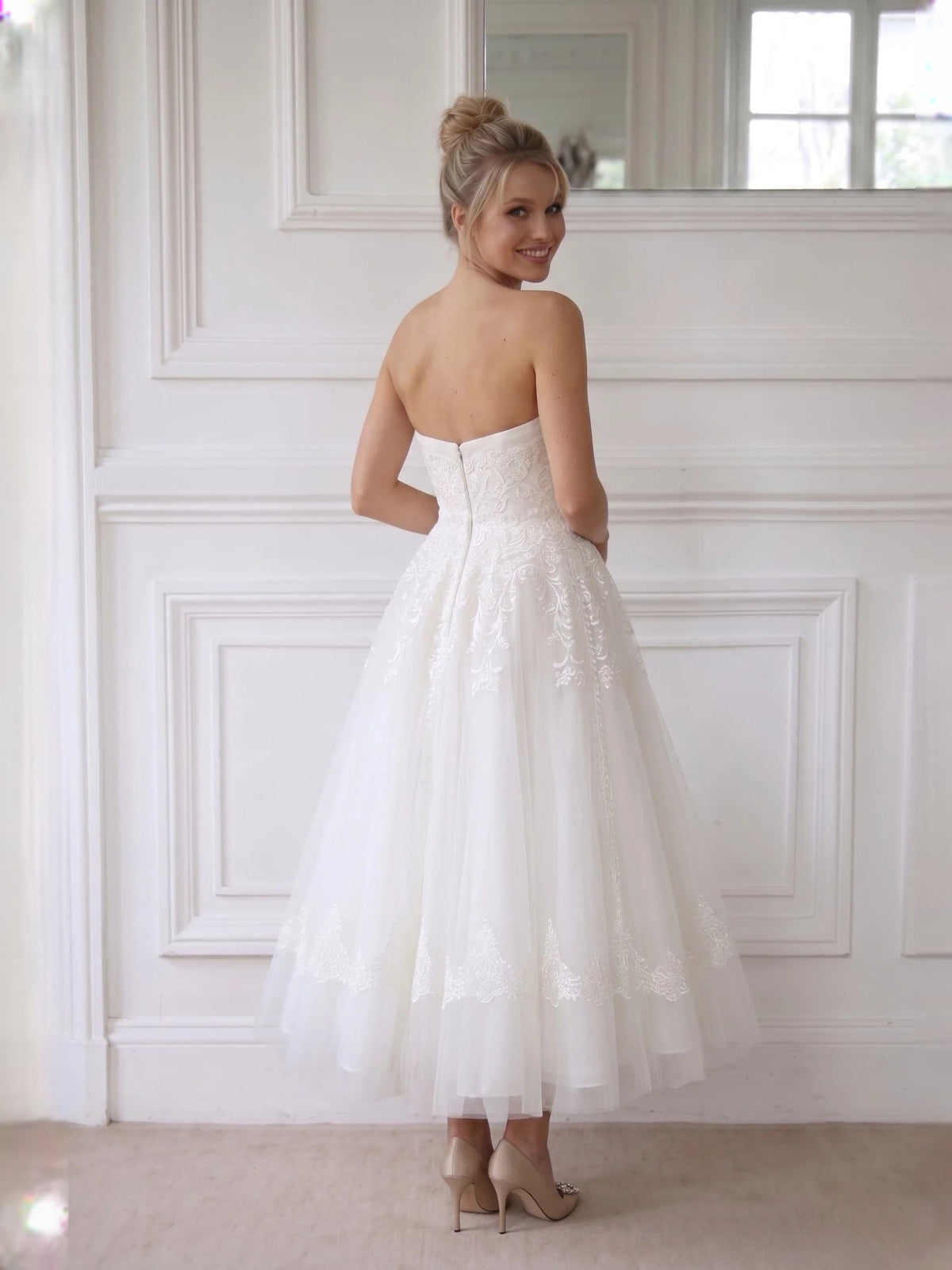 Ivory strapless A-line short wedding dress with lace bodice and voluminous tulle skirt