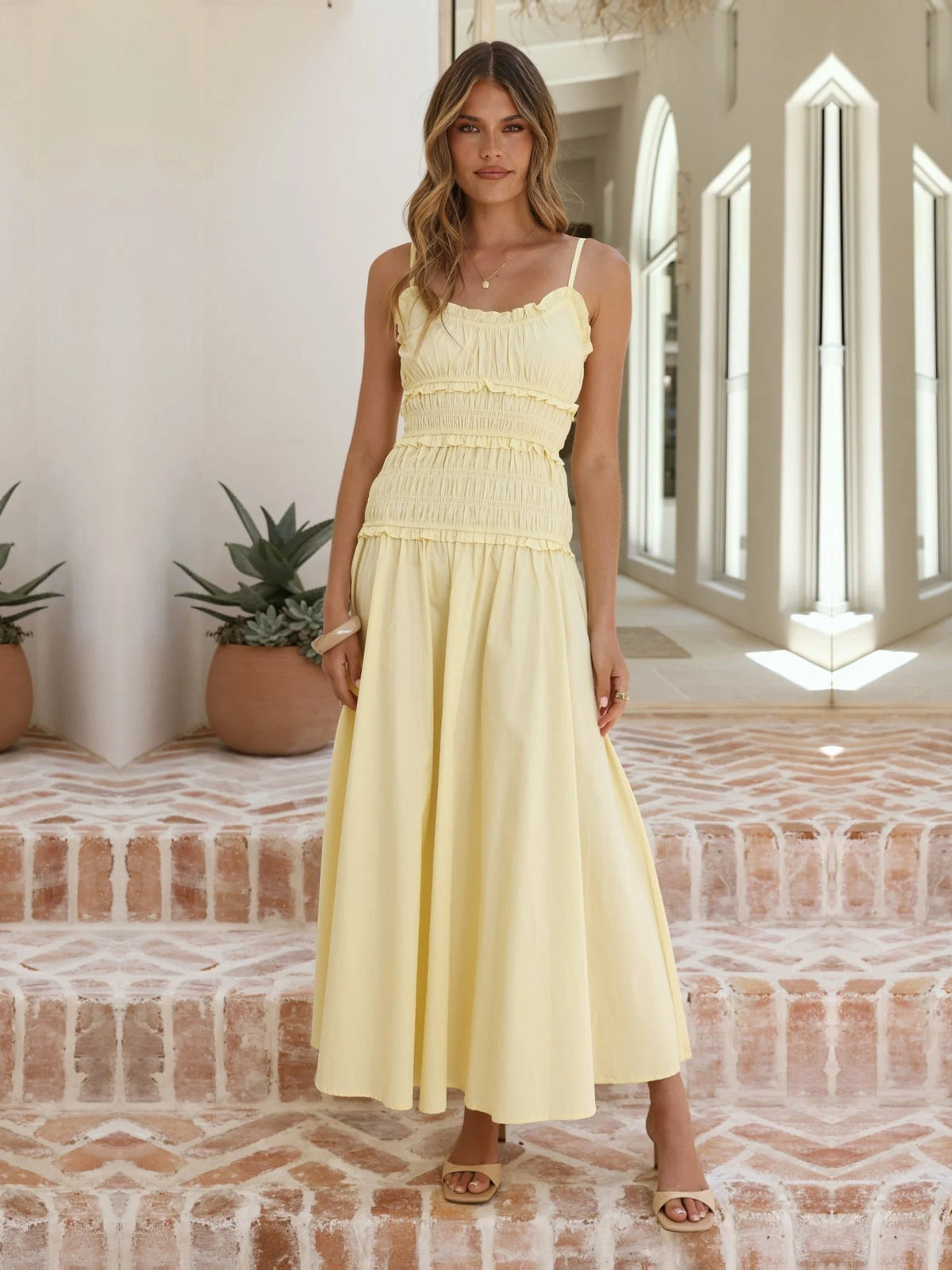 Yellow a-line maxi formal dress with a-line, alternate view showing the hem