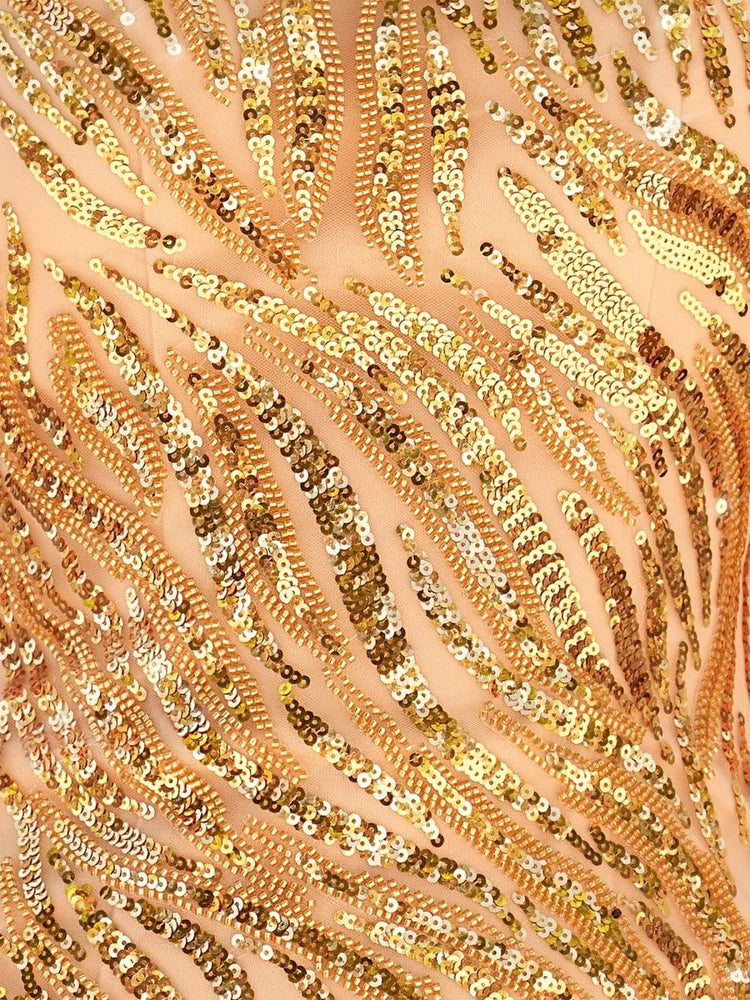 Close-up of gold sequin beading with shimmering rows and fringe texture