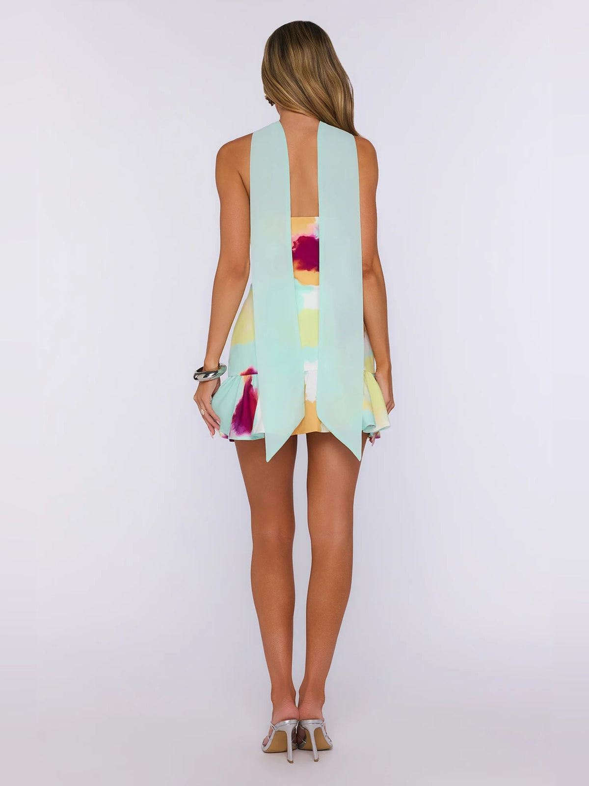 Strapless mini homecoming dress, back view of watercolor print and flared hem