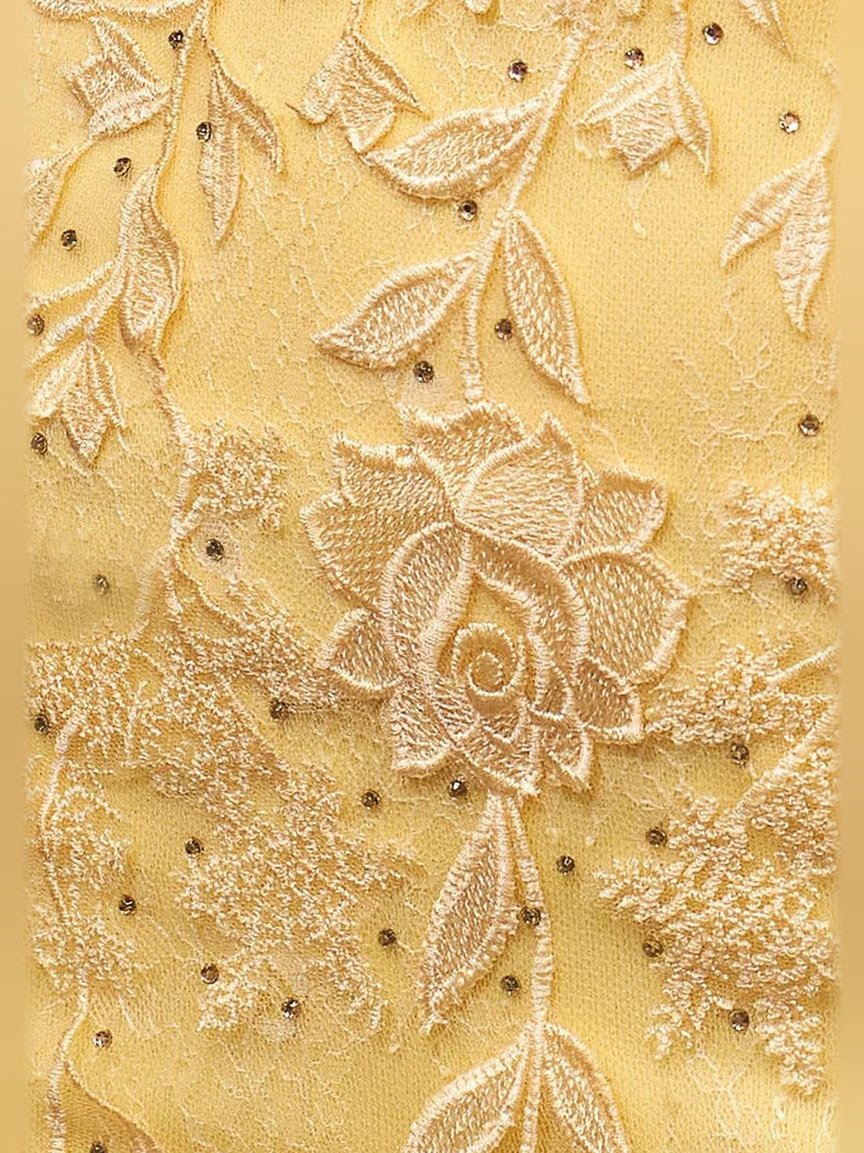 Close-up of yellow embroidered floral corset bodice