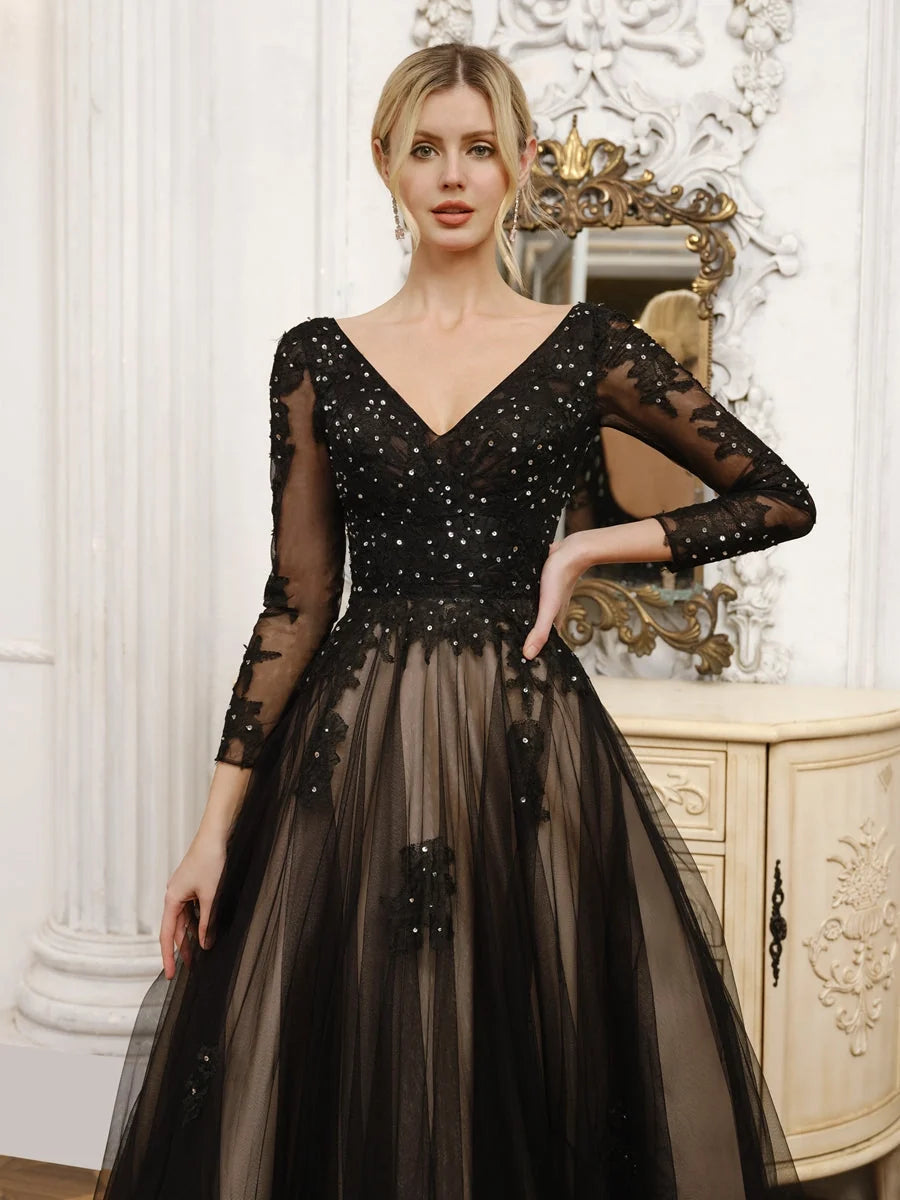 Black V-neck corset bodice wedding dress with long sheer sleeves and layered tulle skirt