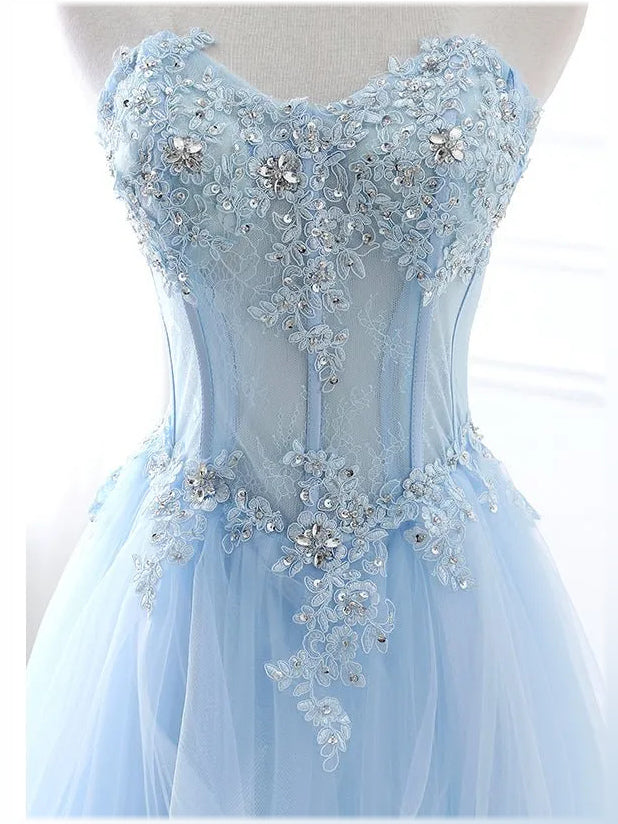 Close-up of light blue tulle corset bodice with floral beadwork and sweetheart neckline