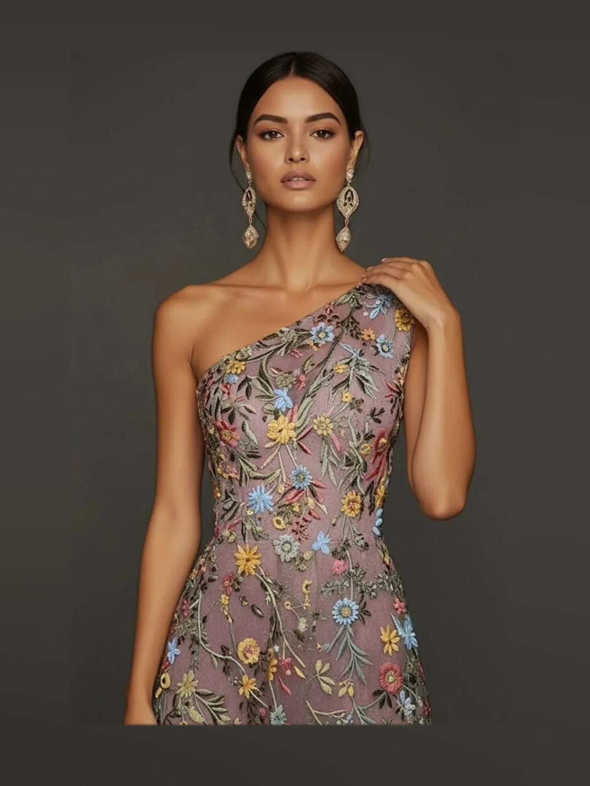 Close-up of dark floral embroidered one-shoulder prom dress bodice and neckline