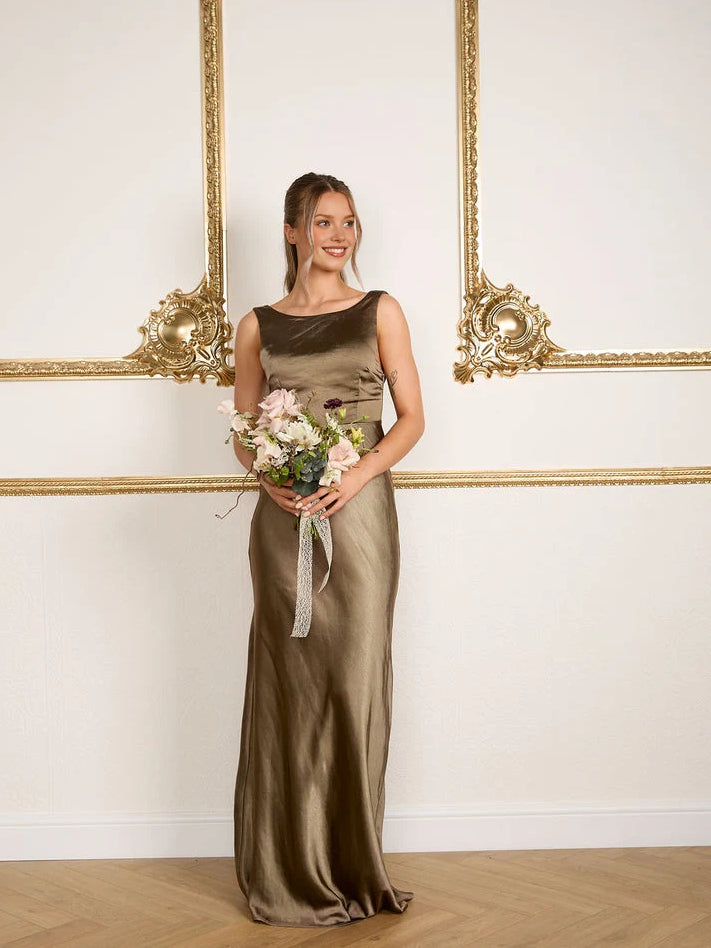Olive green cowl-neck mermaid bridesmaid dress, sleeveless, floor-length, bouquet in hand