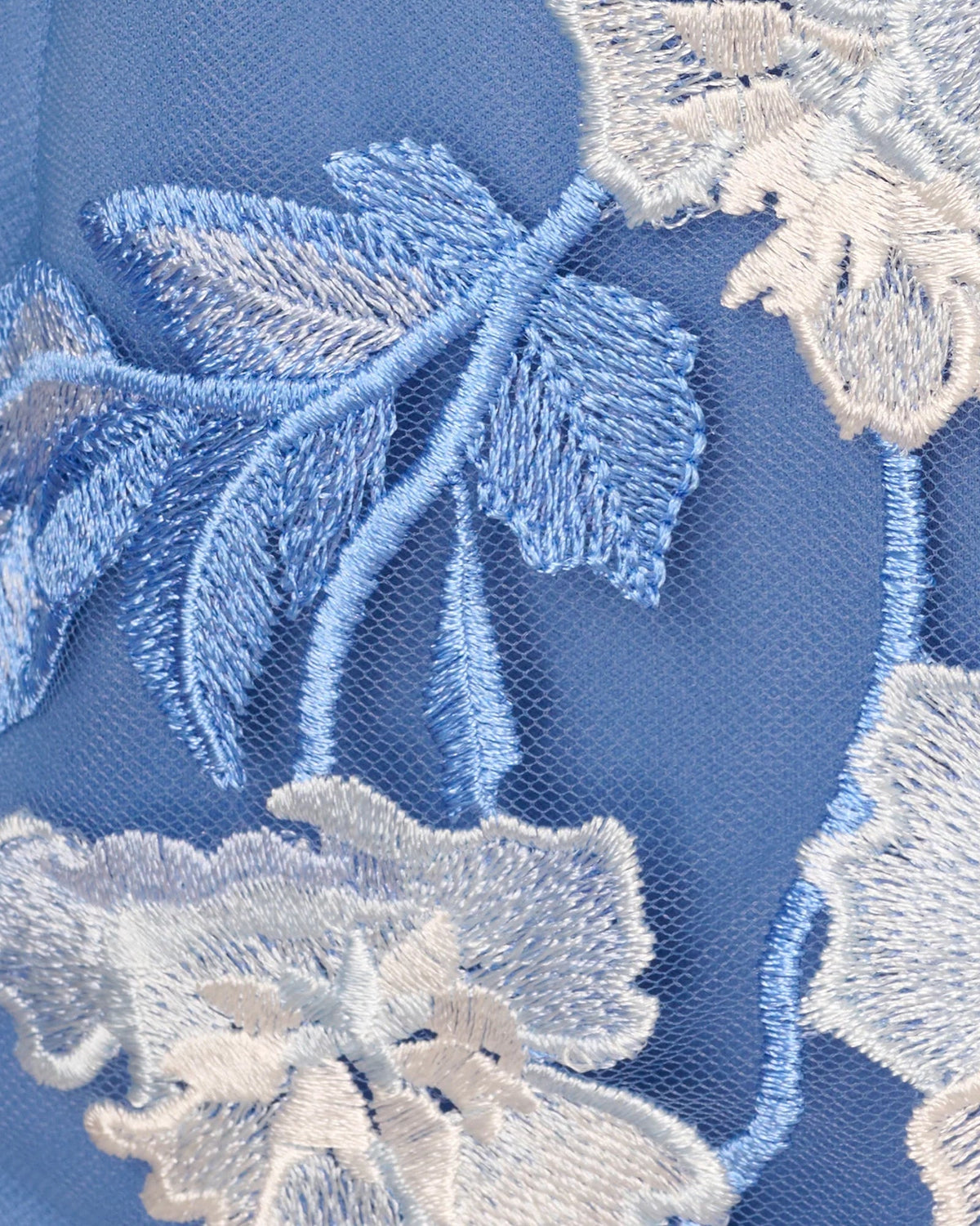 Blue floral lace embroidery on sheer mesh, detailed close-up