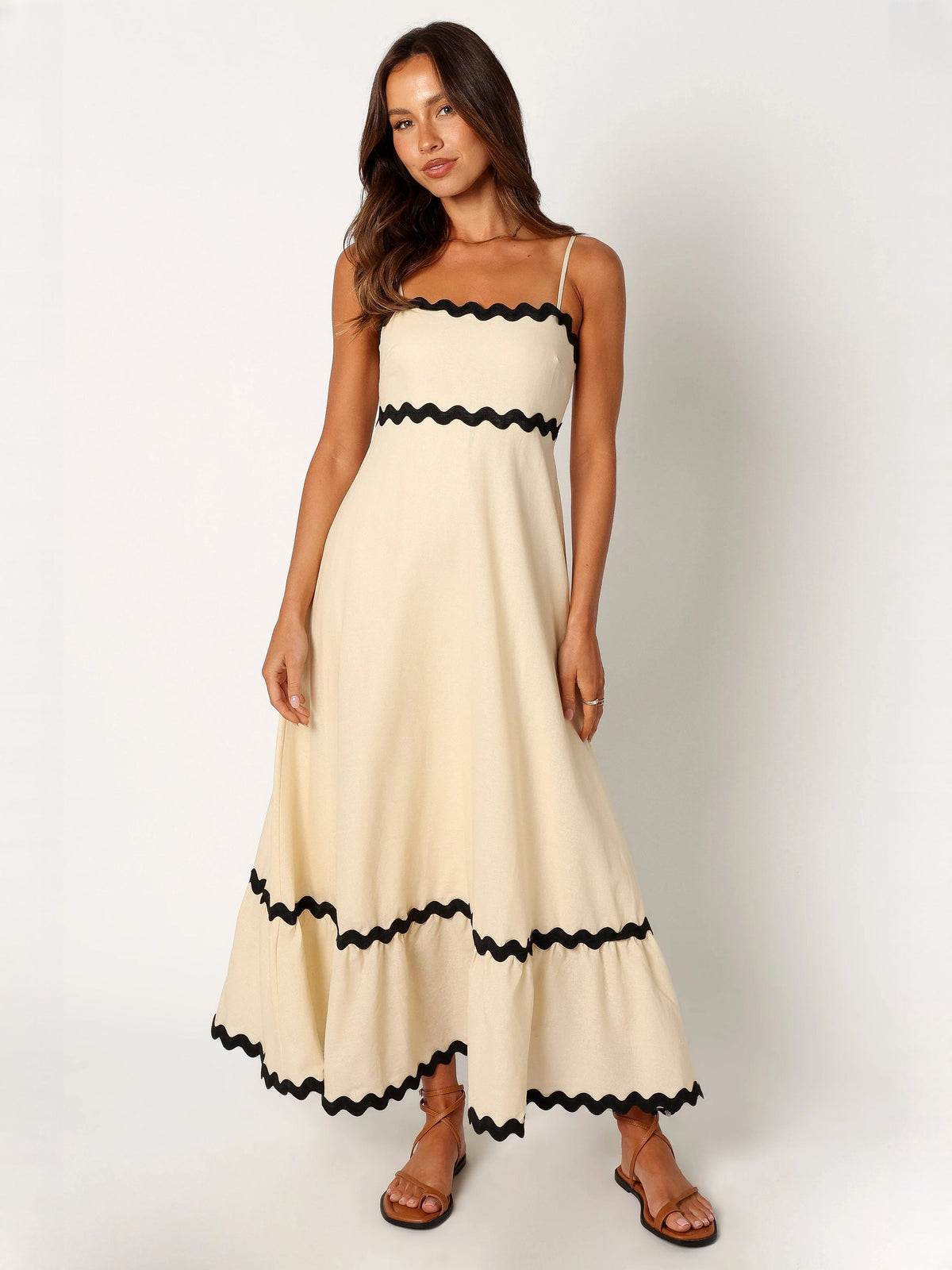 Black a-line maxi formal dress with strapless neckline, alternate full-length view showing the hem