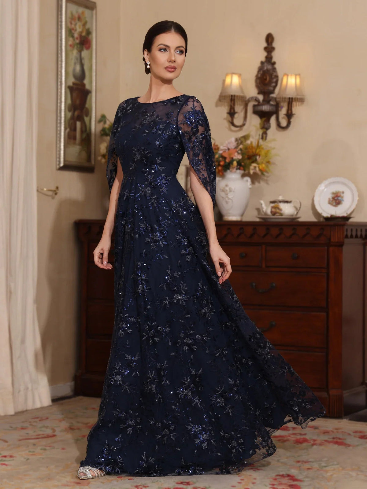 Dark navy tulle A-line gown with illusion neckline and delicate floral appliques