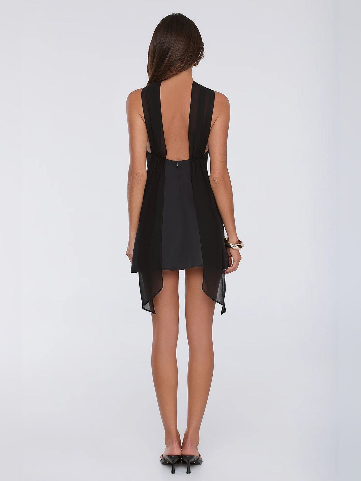 Black satin halter mini dress back view with open-back straps and draped panels