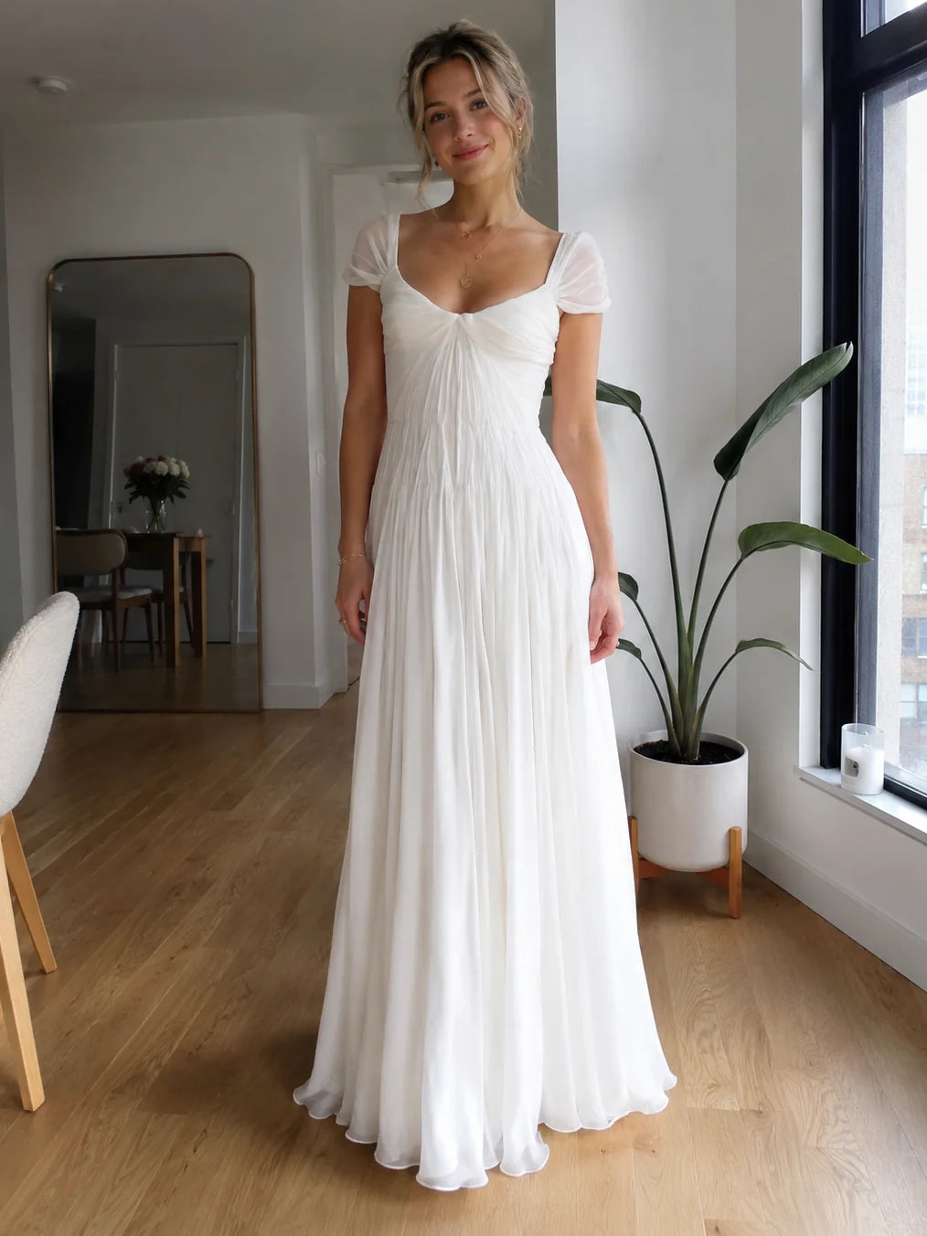 Ivory A-line wedding dress with short puff sleeves and draped ruched bodice