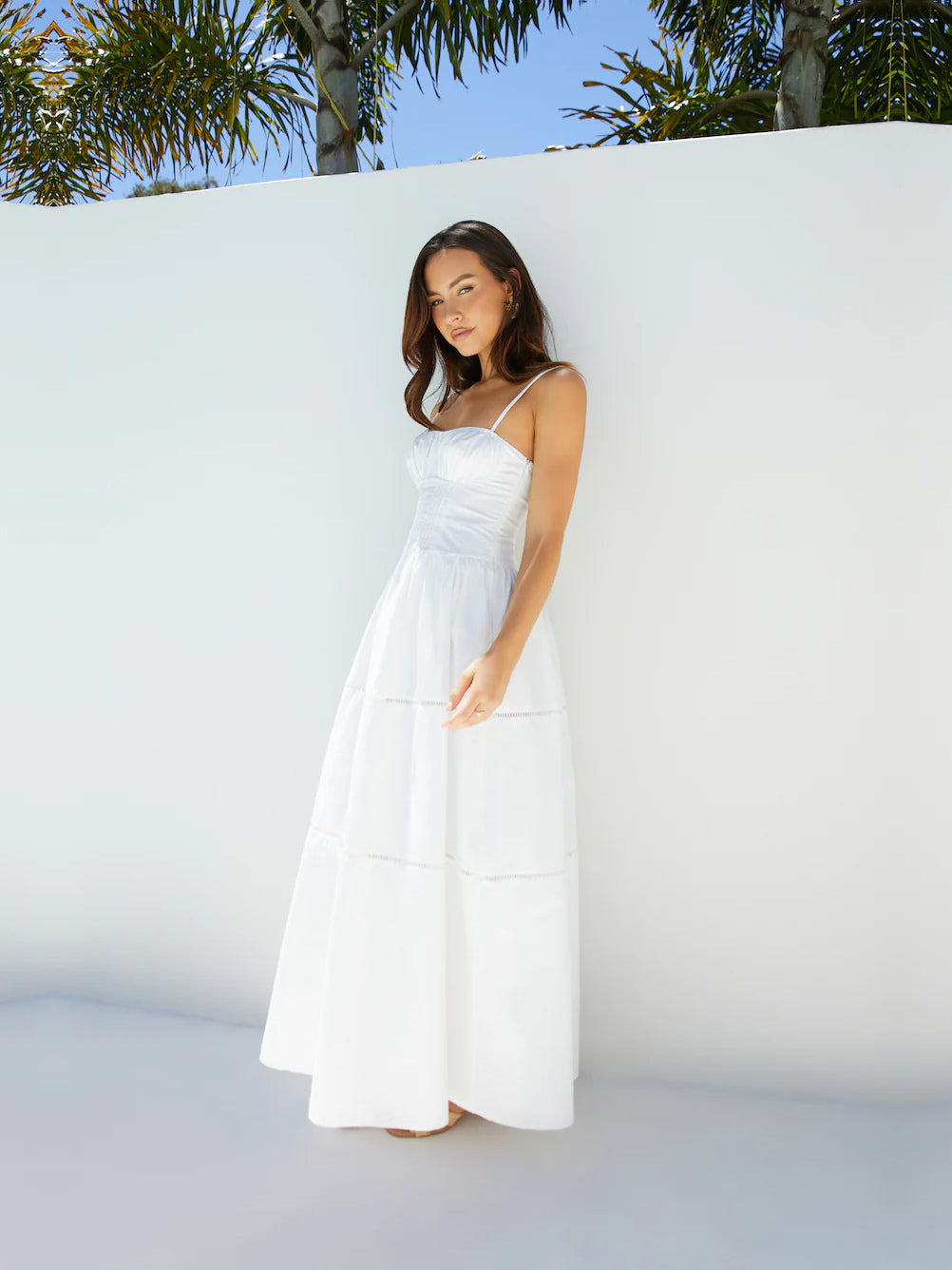 White a-line maxi formal dress with tiered skirt, alternate view showing the hem