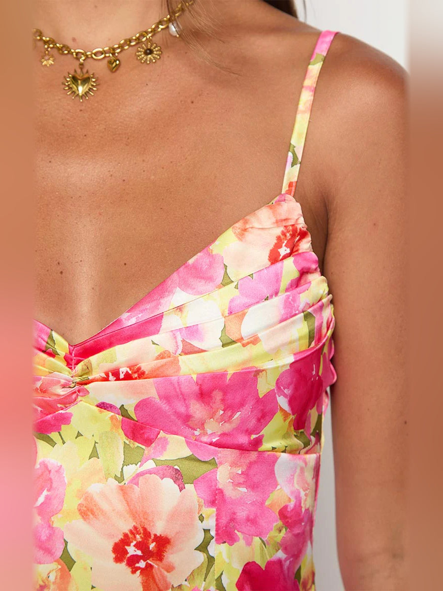 Close-up of floral mini dress bodice with spaghetti straps, pink and yellow blossoms