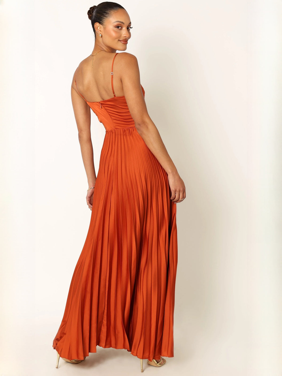 Orange pleated maxi dress with spaghetti straps and ruched bodice (back)