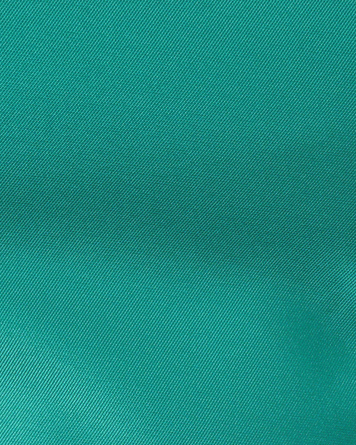 Emerald green textured woven fabric swatch