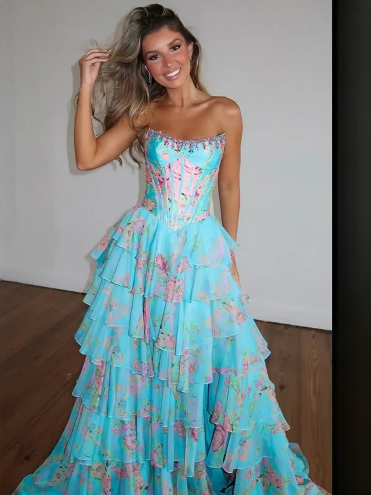 Turquoise floral tiered ruffle strapless A-line prom dress with layered skirt.