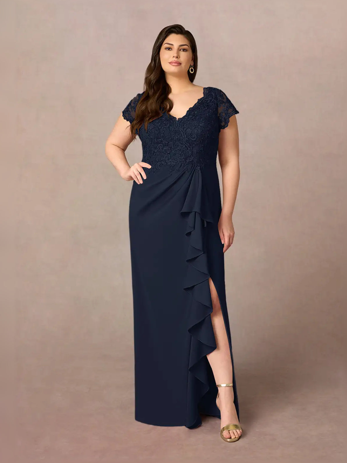 Dark navy mermaid dress with lace overlay shoulders and tiered ruffle drape along one side.