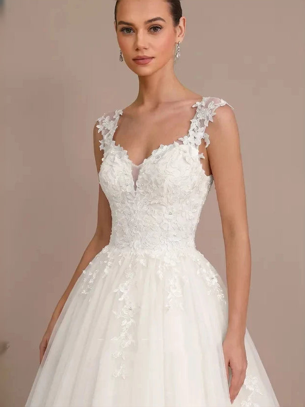 Ivory lace tulle mini wedding dress with V-neckline and floral lace cap sleeves, fitted bodice
