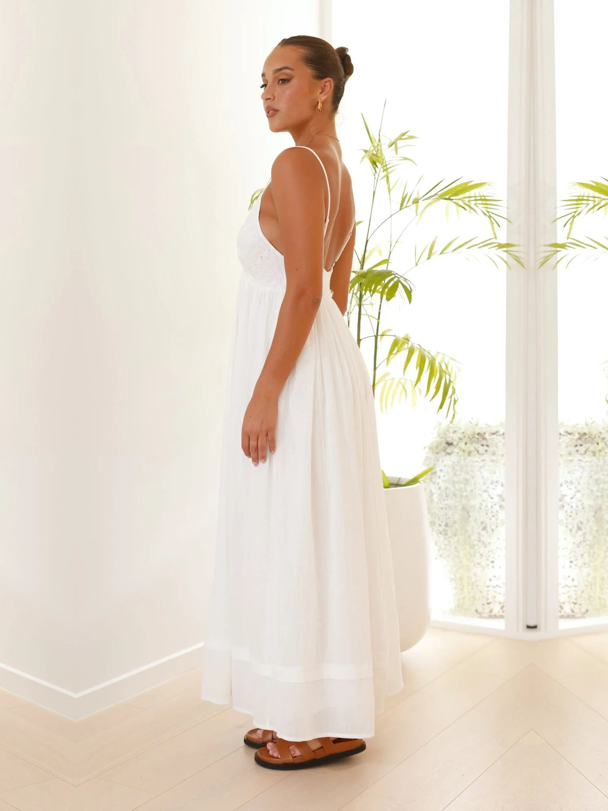 White a-line maxi formal dress with V-neckline, alternate view showing the hem