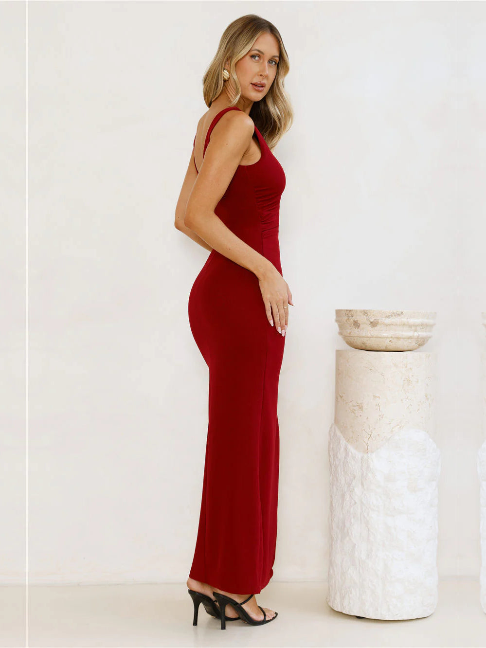 Burgundy sheath maxi formal dress with skirt slit, alternate view showing the hem
