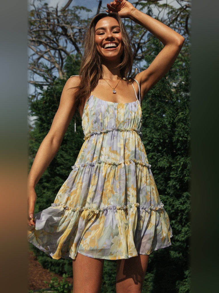 Floral tiered mini dress with spaghetti straps and gathered tiered skirt