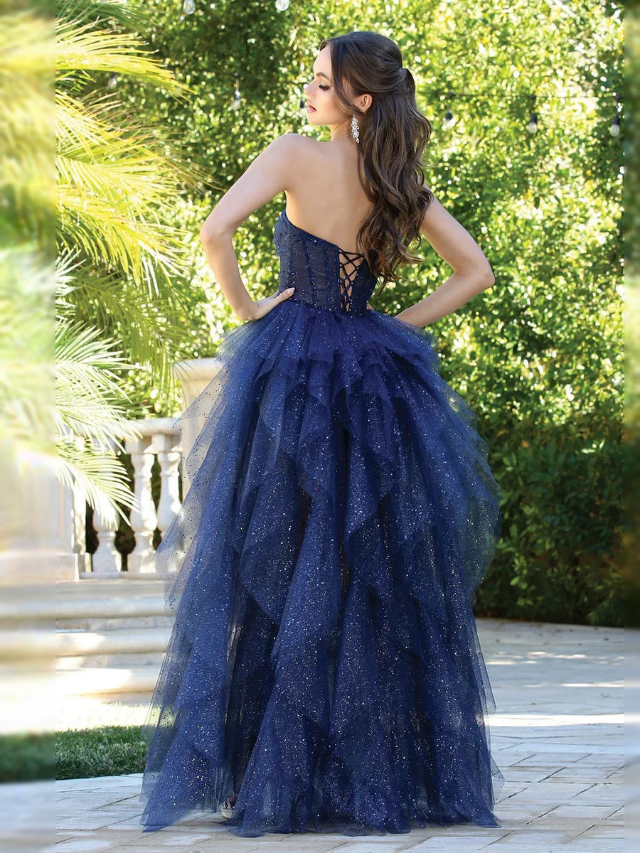 Dark navy strapless corset prom dress from back with full A-line tulle skirt