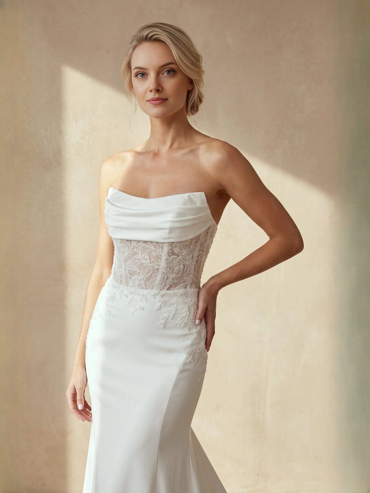 Ivory strapless lace corset wedding dress with draped top and mermaid skirt flare