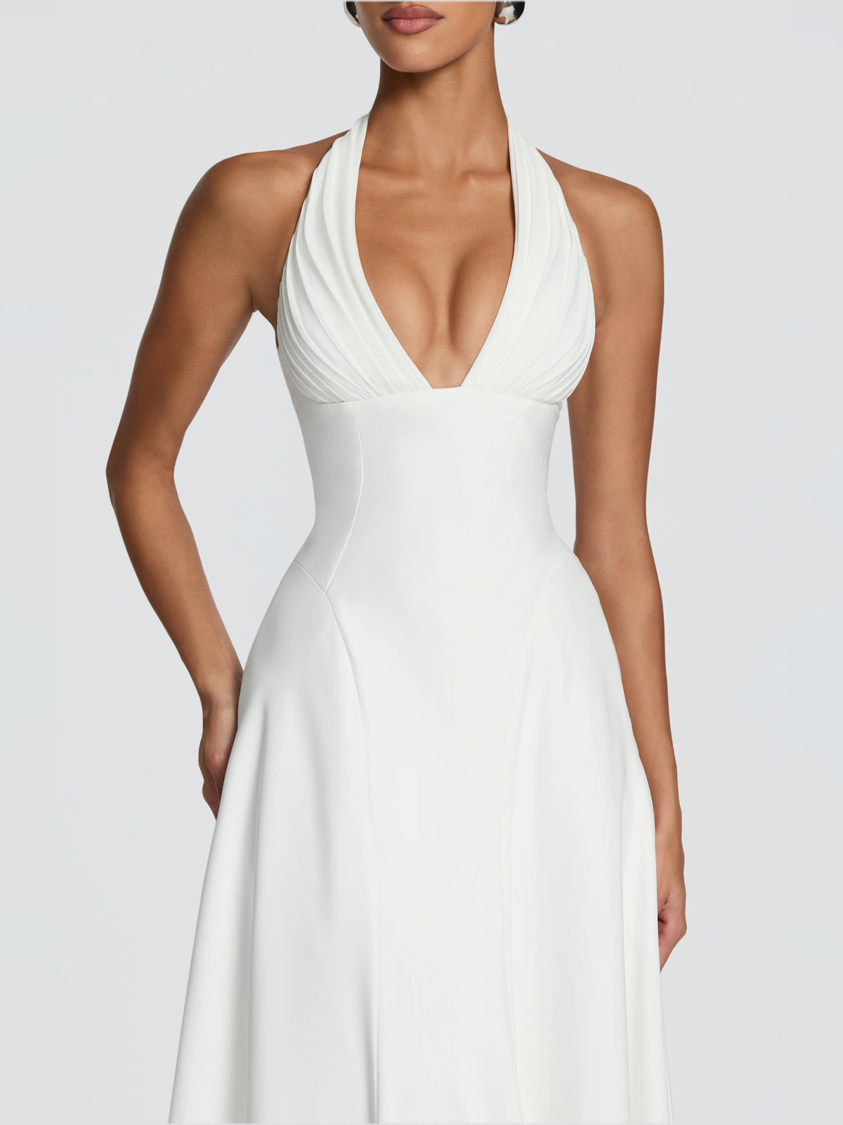 Ivory halter V-neck midi formal dress, close-up of ruched pleated bodice