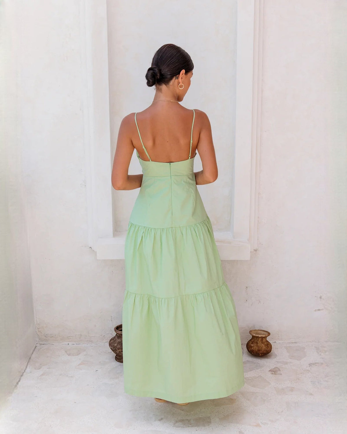 Light green sleeveless tiered maxi dress, back view with spaghetti straps