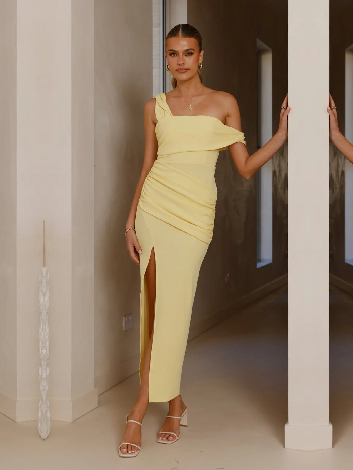 Yellow sheath maxi formal dress with skirt slit, alternate view showing the hem