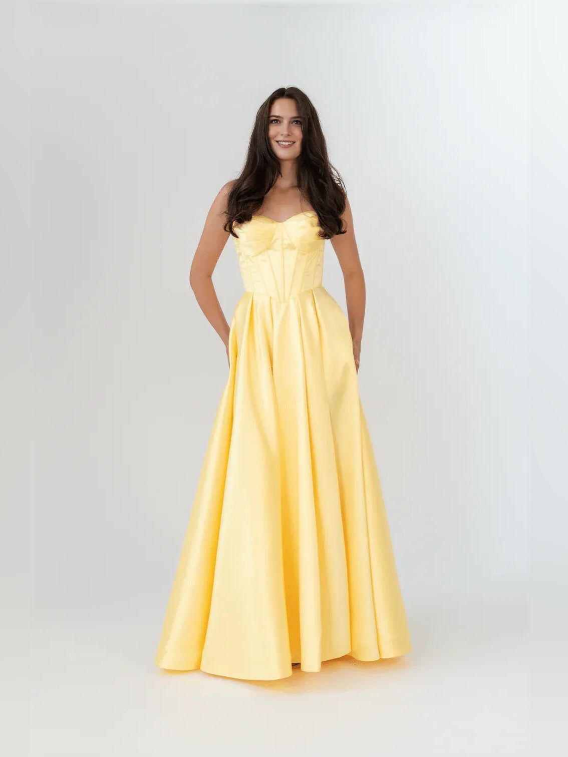 Daffodil yellow strapless corset-style formal dress with sweetheart neckline, floor length