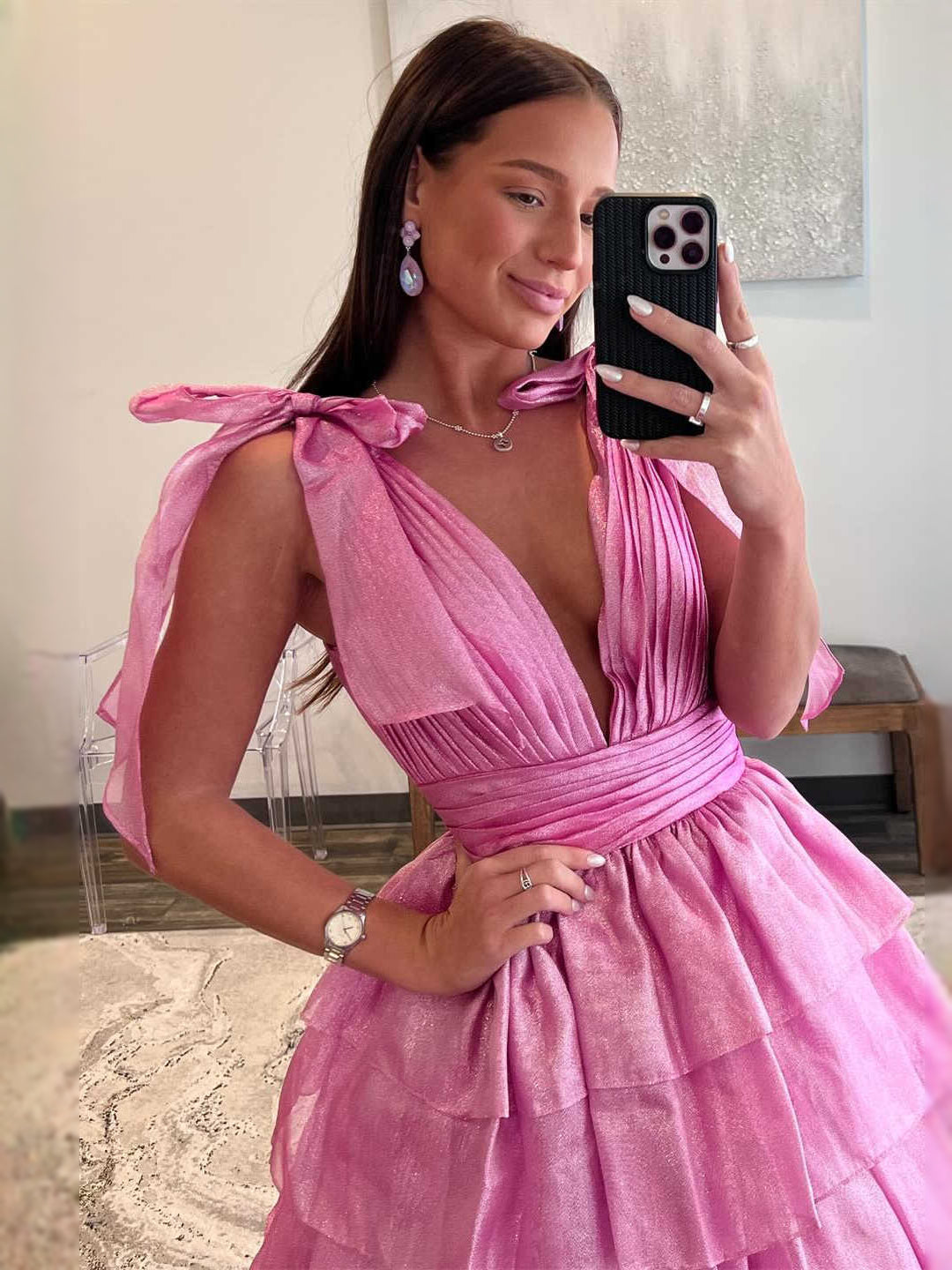 Pink tiered ruffle V-neck A-line maxi tulle prom dress, side view with bow shoulder ties