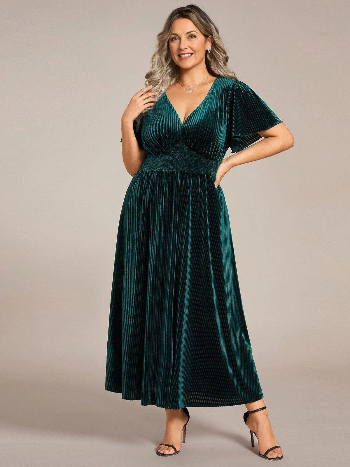 Dark green velvet A-line midi dress with V-neck and flutter sleeves