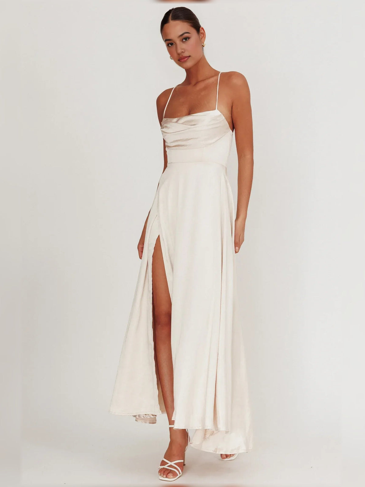 Cream cowl-neck maxi dress with spaghetti straps and high side slit
