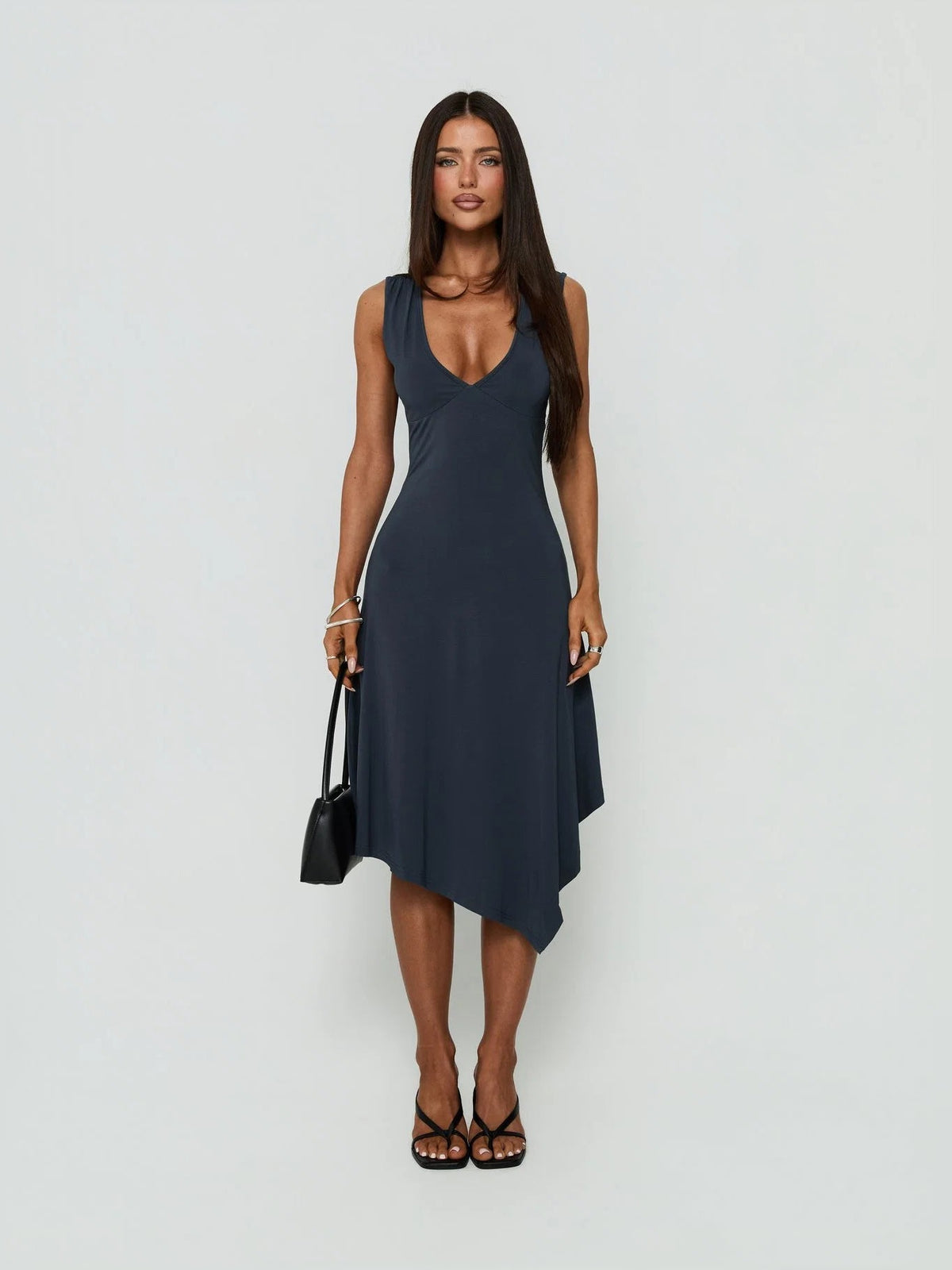Sleeveless V-neck midi formal dress with draped hanky hem and asymmetrical overlap