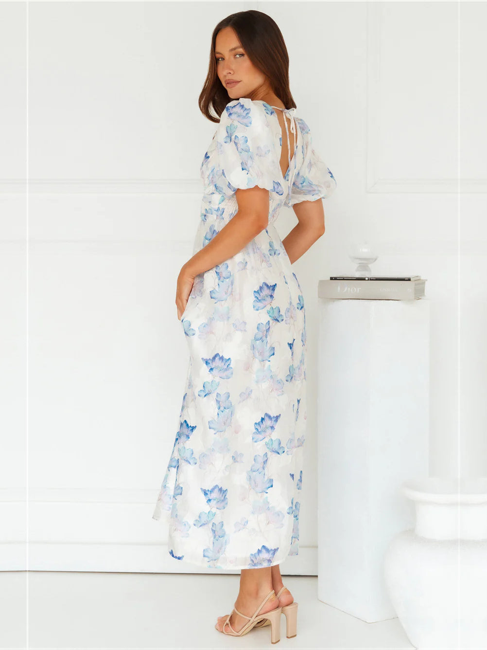 Blue a-line maxi formal dress with floral print, alternate view showing the hem