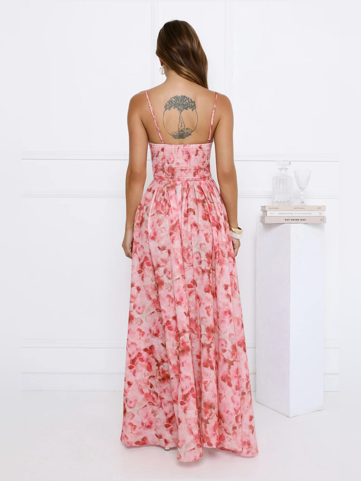 Pink floral midi formal dress rear view with open back and gathered waist