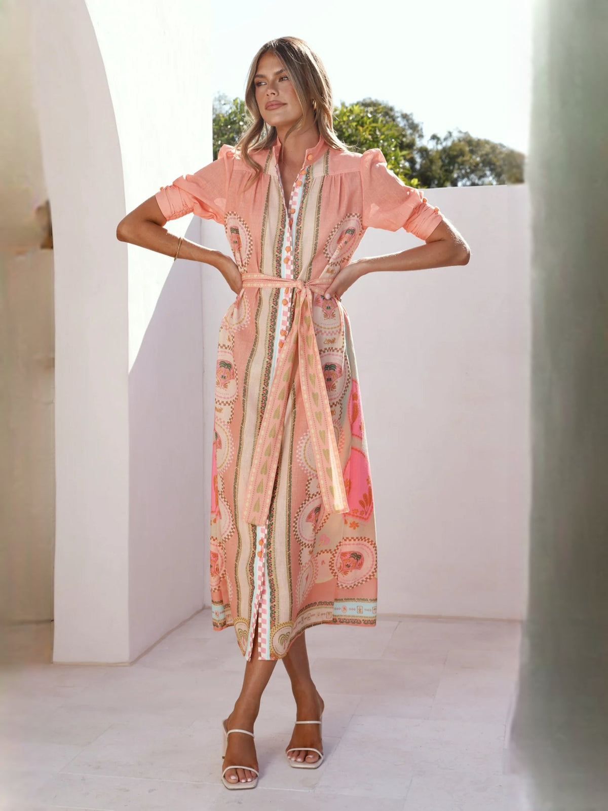Peach midi formal dress with V-neck, medallion print, tie belt, and puff sleeves