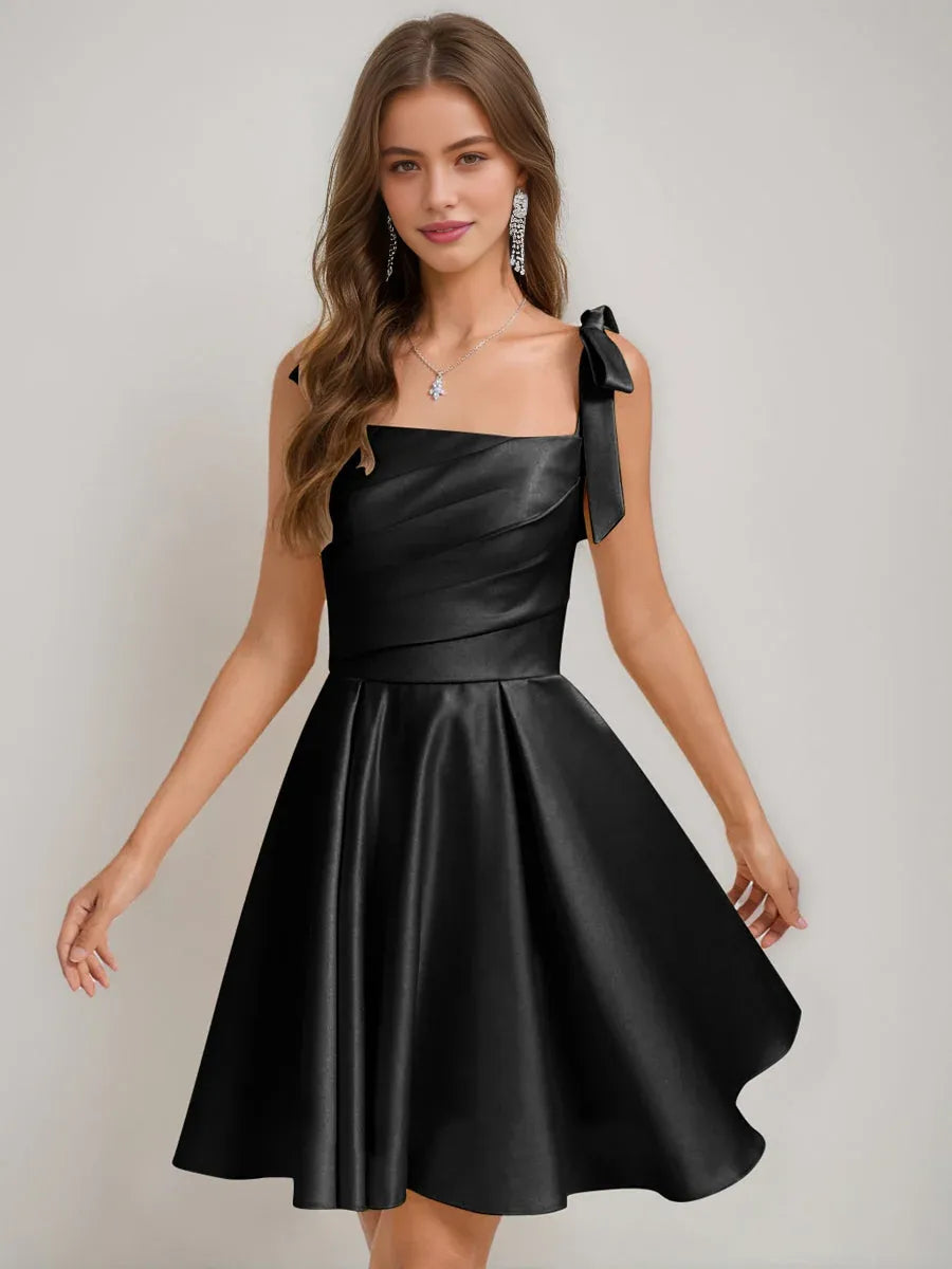 Black satin corset-style square neck A-line short dress with bow shoulder tie detail.