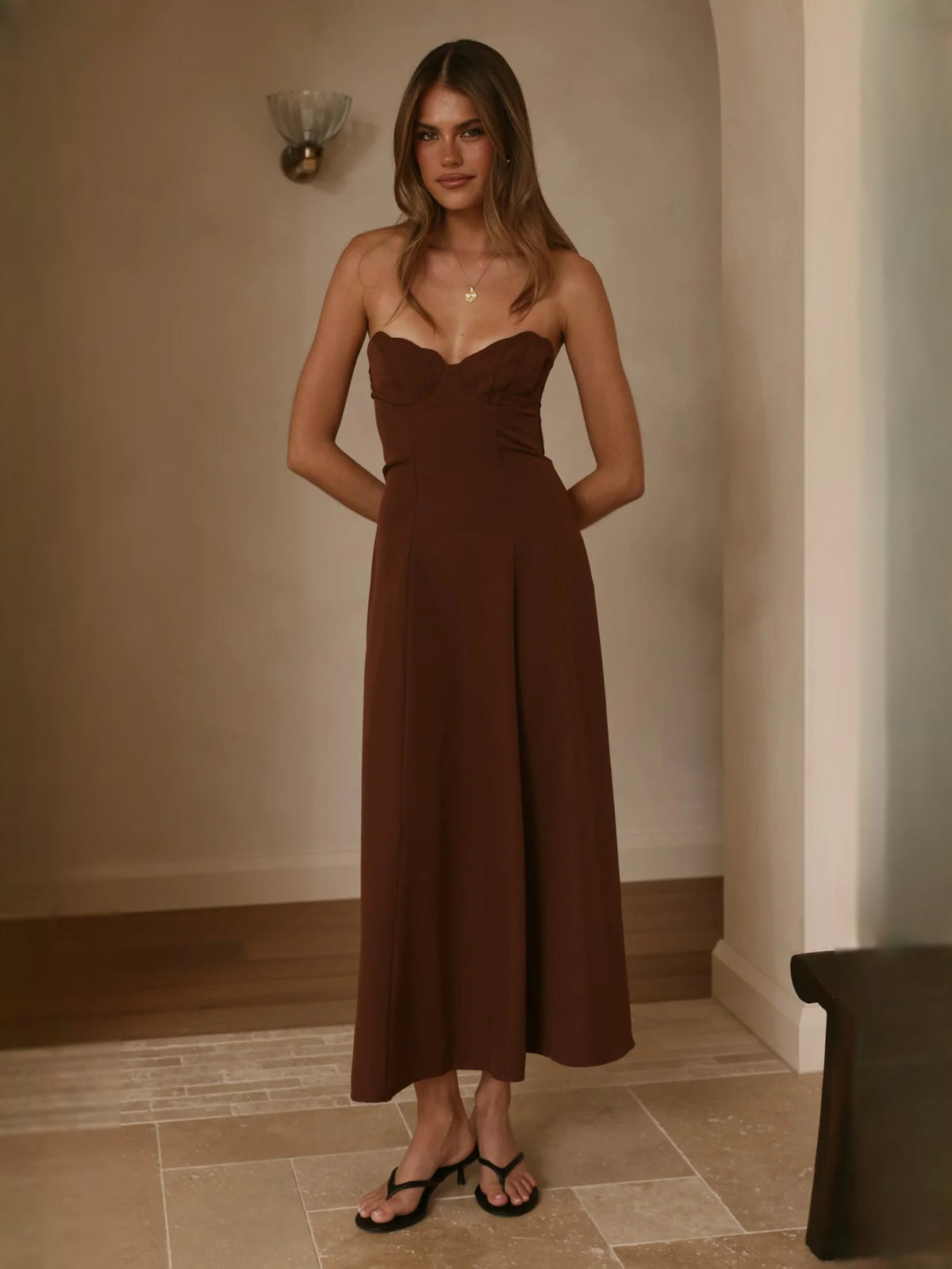 Chocolate strapless midi formal dress, fitted bodice and flowing skirt front view