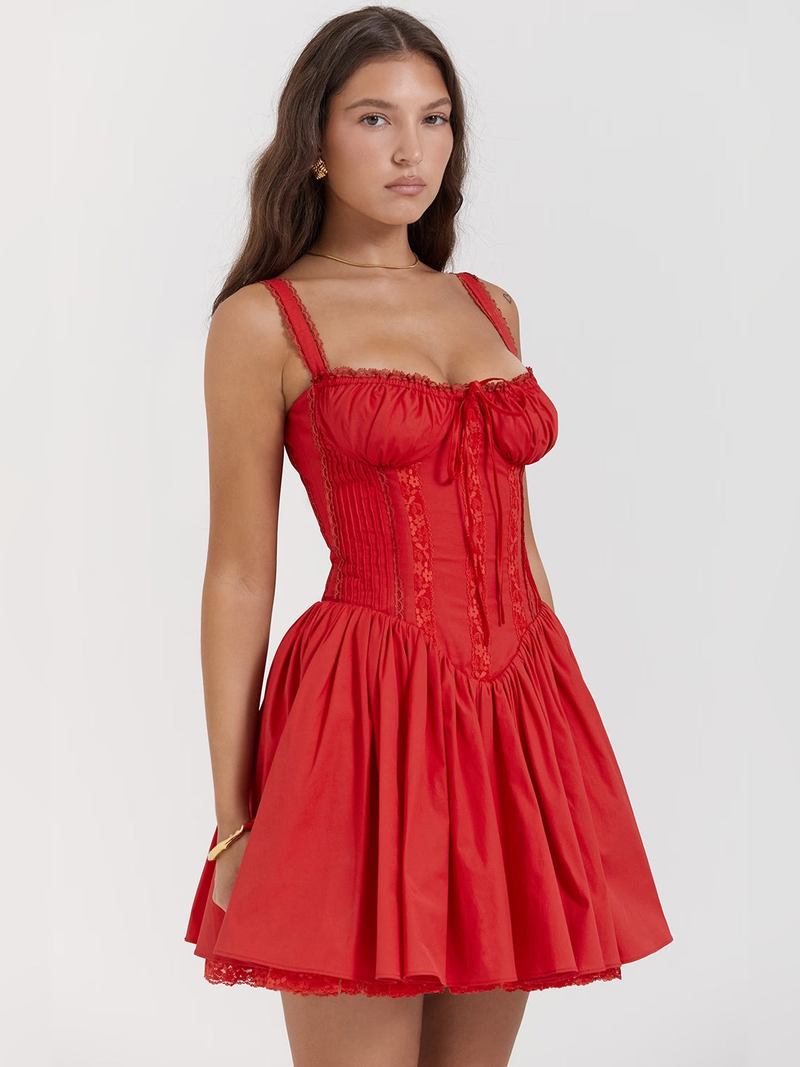 Red corset mini homecoming dress with gathered corset bodice and flared tiered skirt