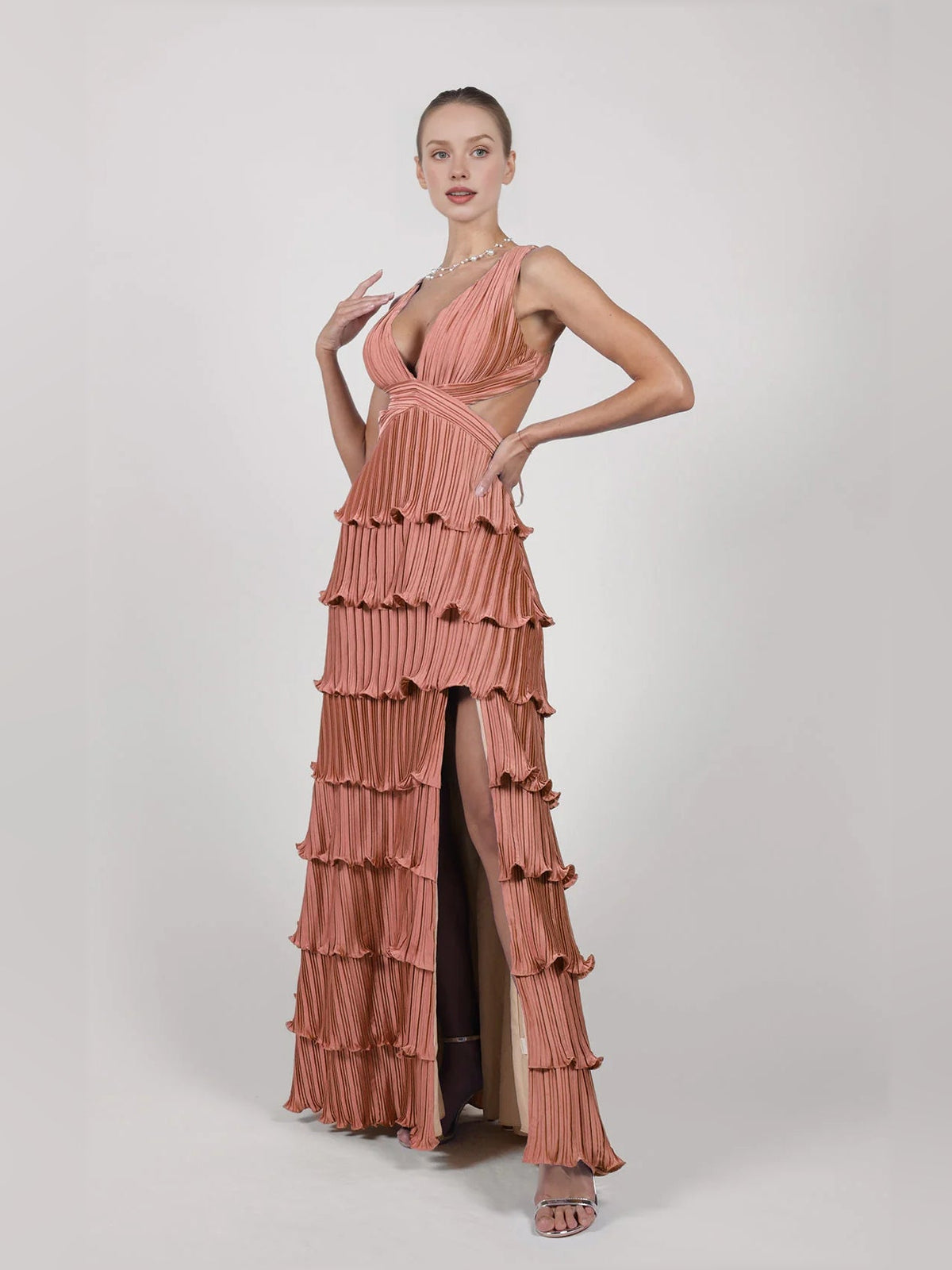 Dusty rose v-neck pleated tiered formal dress with side slit and layered ruffle tiers.