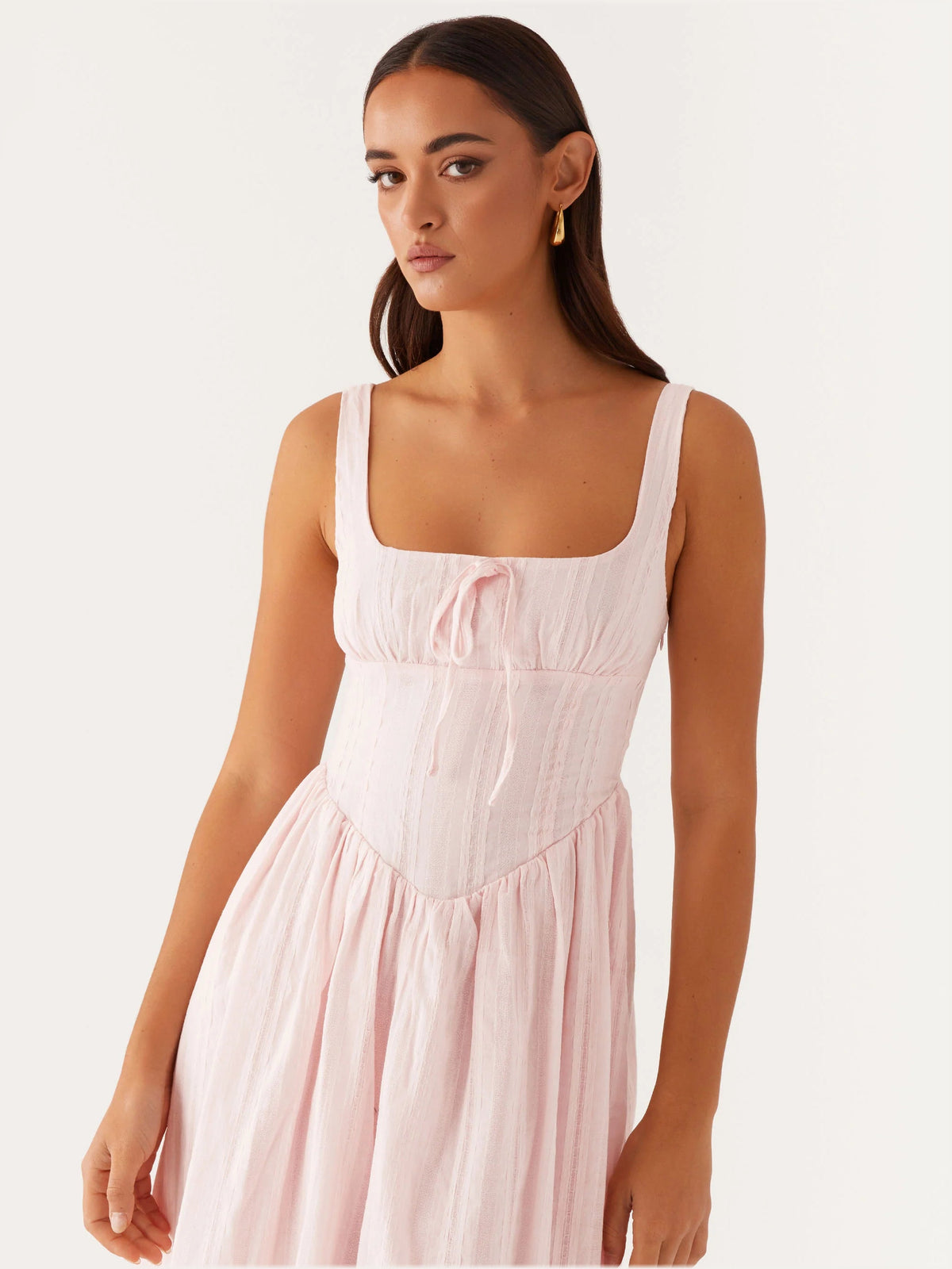 Pink sleeveless midi dress close-up with square neckline and smocked bodice