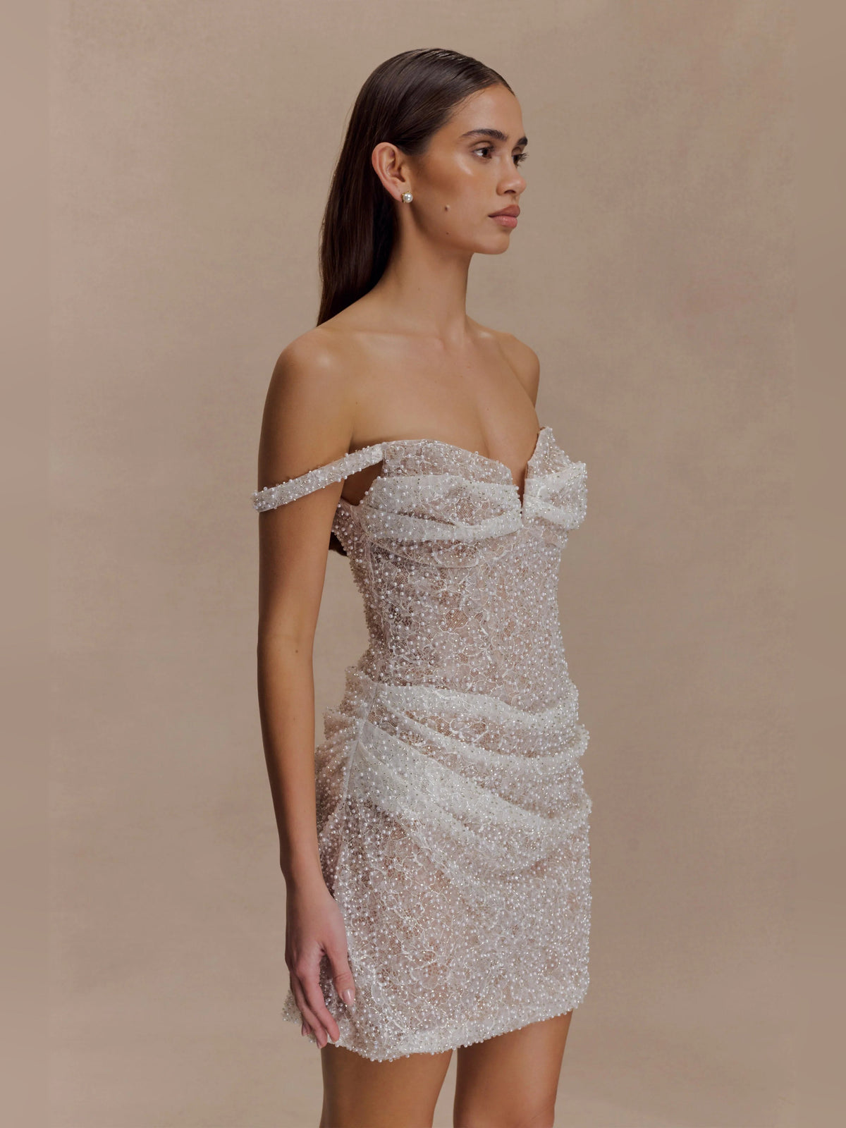 Nude beaded off-shoulder bodycon mini dress with sweetheart bodice and short hem