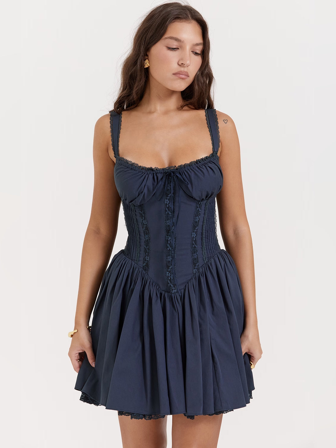 Navy corset mini dress with ruched bodice, spaghetti straps, flared tiered skirt