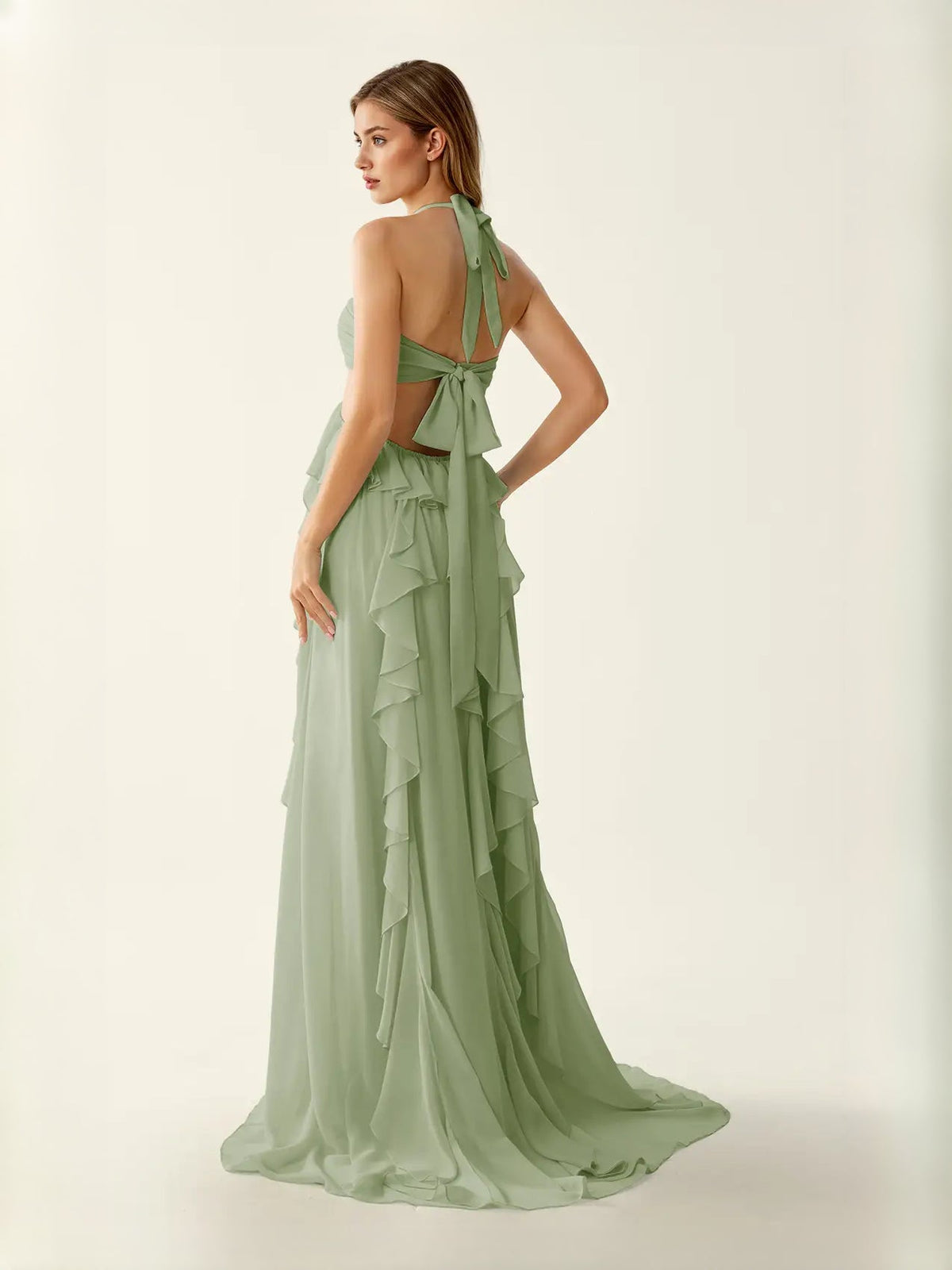 Sage green chiffon prom dress with halter neck and open back ruffle detail