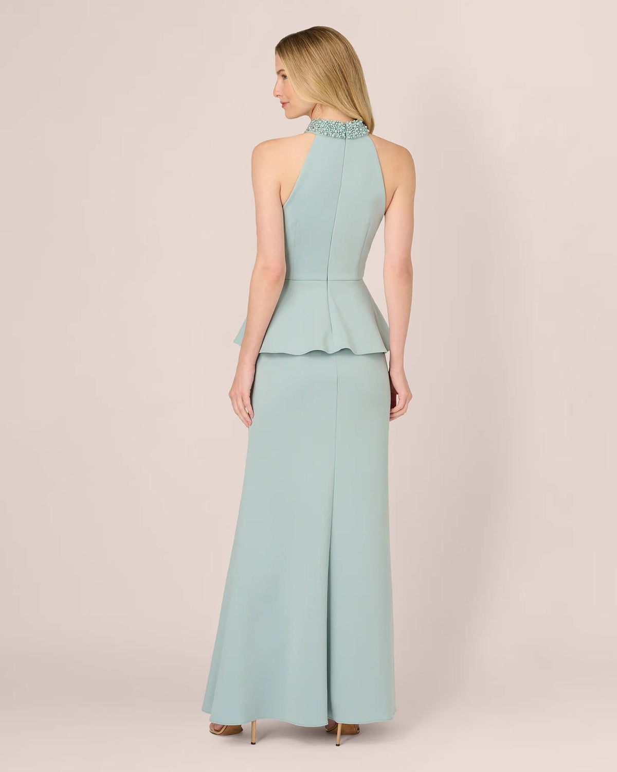 Mint halter back maxi dress with peplum waist and straight skirt, open neckline detail.